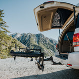Destination E bike rack with electric bike attached to SUV trunk at mountain location