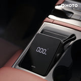 HOTO Electric Air Pump displaying 0.00 bar pressure in a car console.