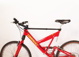 Bike Adapter Pro on a red full suspension bike, designed for sloping top tubes.