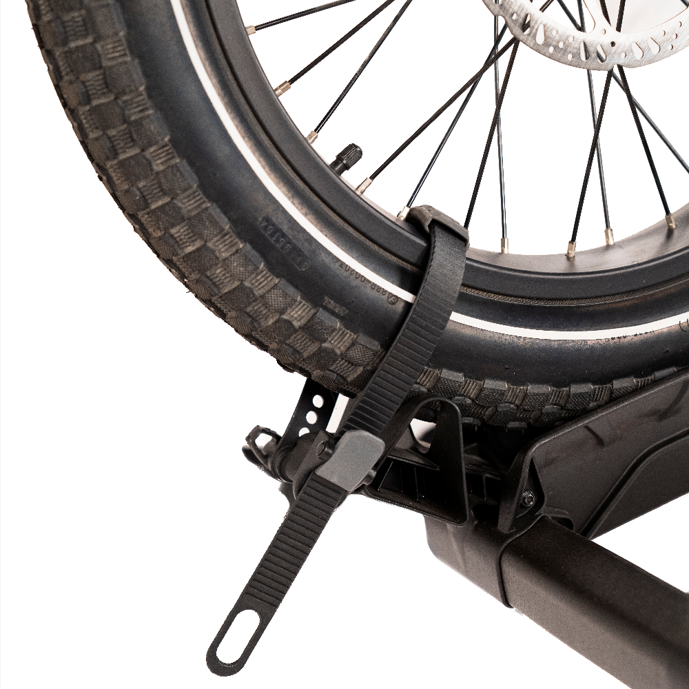 Adjustable strap securing electric bike tire on Destination E hitch rack.