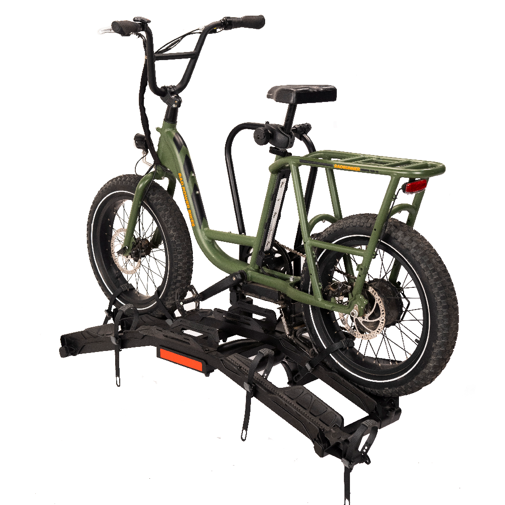 Green electric bike on Destination E hitch rack with fat tires secured for transport.